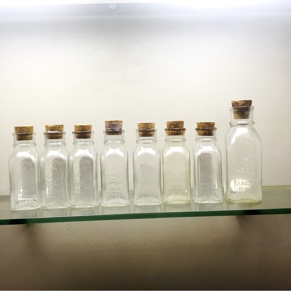 BOGO Eight pretty corked embossed glass jars-- 7 are 4 ounce, 1 is 8 ounce